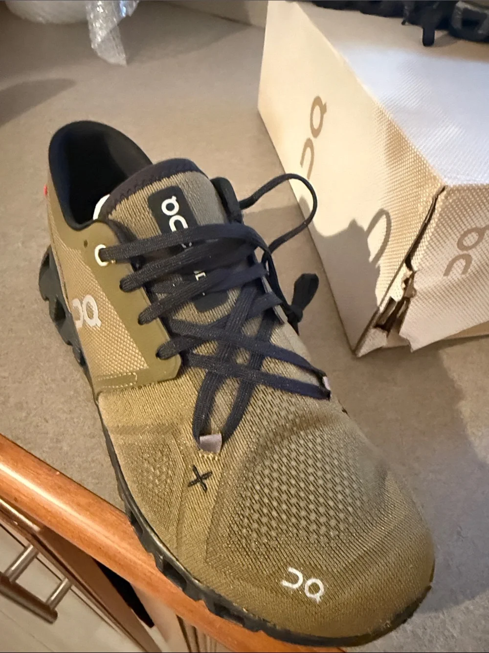 On cloud X3 in hunter and black. New with box.